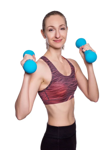 Happy sporty woman with blue dumbbells doing sport exercise. Isolated on white background. — Stock Photo, Image