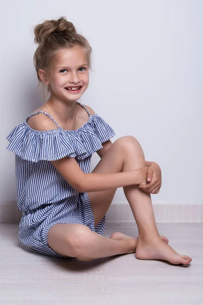 Beautiful Little Fashion Model On White Background Portrait Of Cute Smiling Girl Posing In