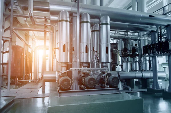 The interior of a modern industrial gas boiler room. Pipelines, water pumps, valves, manometers. — Stock Image The interior of a modern industrial gas boiler room. Pipelines, water pumps, valves, manometers. Stock Picture