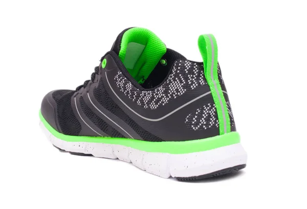 Limão verde e preto esporte unissex sapatos isolados no fundo branco . — Fotografia de Stock
