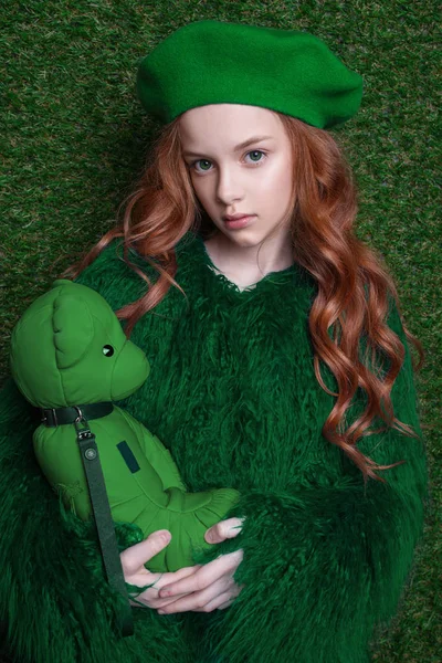 Fashion studio portrait of cute little redhead girl wearing green clothes. — Stock Photo, Image