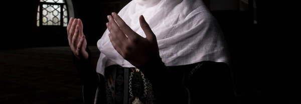Girl with hijab praying