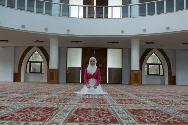 Muslim woman praying in mosque