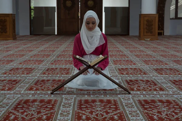 Muslim Woman in Mosque Reading Koran