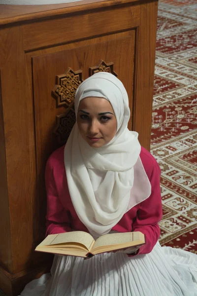 Muslim Woman in Mosque Reading Koran