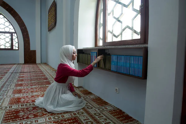 Muslim Woman in Mosque Reading Koran