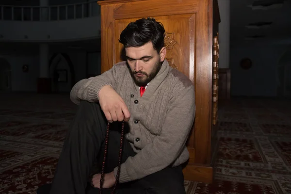 Young muslim man praying