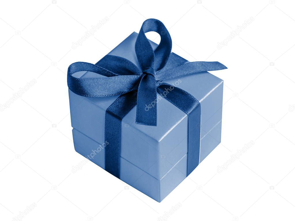 Gift box with ribbon in modern classic blue color isolated on white background.