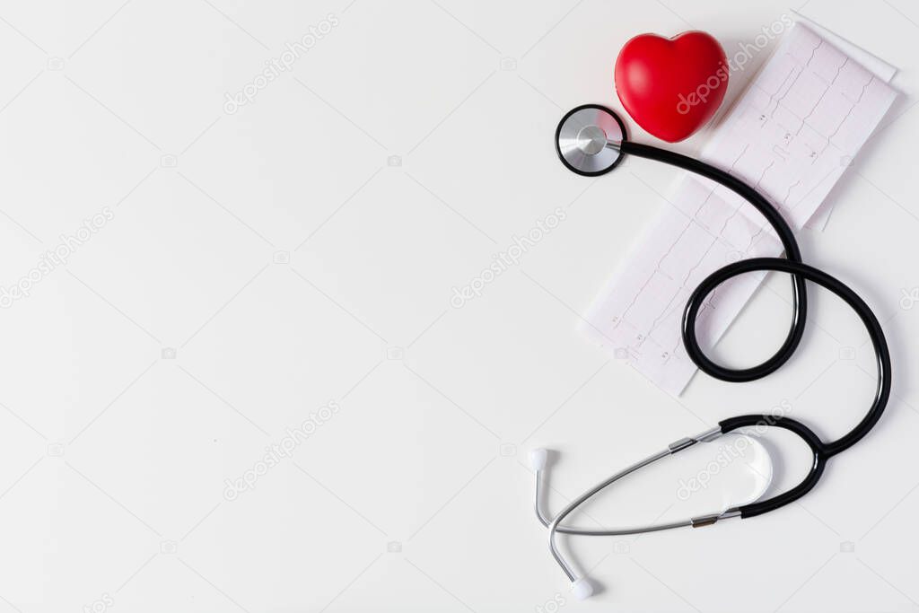Doctor's stethoscope with red heart and cardiogram. Healthcare medical concept.