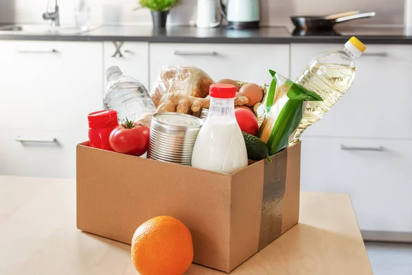 Cardboard Box Various Food Bottle Milk Water Table Kitchen Interior — Stock Photo, Image