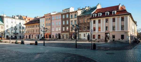 Wide angle view of the little market square, Maly Rynek, in the old town of Krakow, Poland.