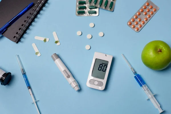 Medicine, healthcare, technology and online pharmacy concept. A diabetic measures your blood glucose.