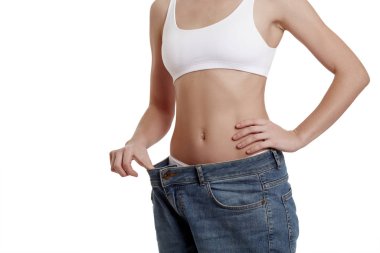 Beyaz iç çamaşırlı genç bir kızın mükemmel, ince, genç vücudu. Kilo kaybı ve sağlıklı beslenme. Büyük beden kotlu bir kadın. Obezite sorunu. Estetik ameliyat.