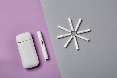 Elektronik Sigara Teknolojisi. Tütün IQOS sistemi. Elektrikli hibrit sigarayı ısıtma yastığıyla kapatın. tütün ısıtma sistemi. Yeni tütün ısıtma sistemi. Elektronik sigara mokaseni.