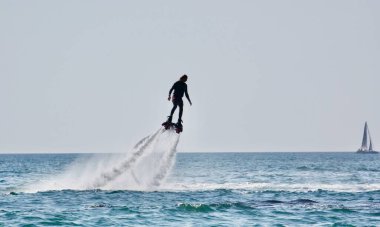 Water attraction flyboard on the beach of Sochi