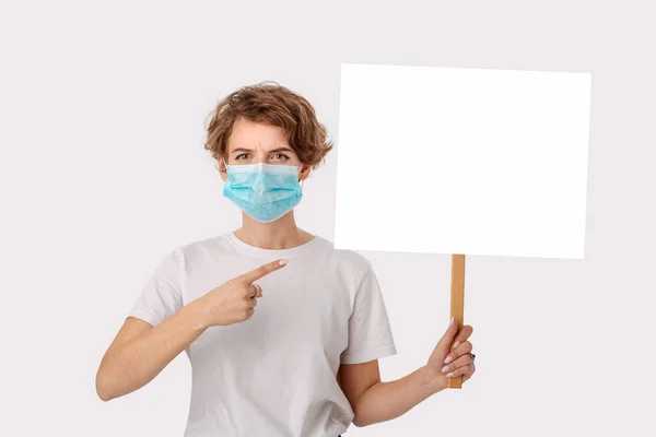 Worried Young Woman White Shirt Wearing Blue Medical Mask Holds — Stock Photo, Image