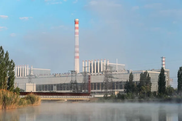 Industrial power plant in the mist