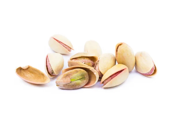 Pile of roasted pistachios isolated on white background — Stock Photo, Image