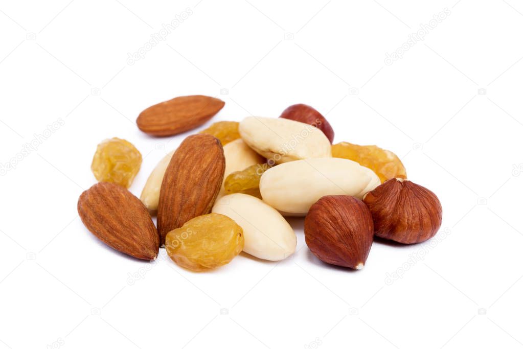Mixed fresh nuts and raisins isolated on white background