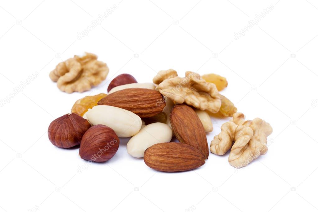 Mixed fresh nuts and raisins isolated on white background