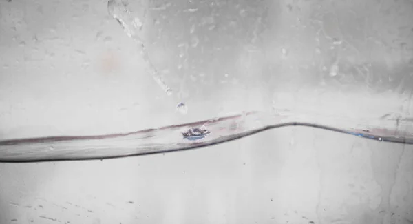 Flowing water with bubbles — Stock Photo, Image