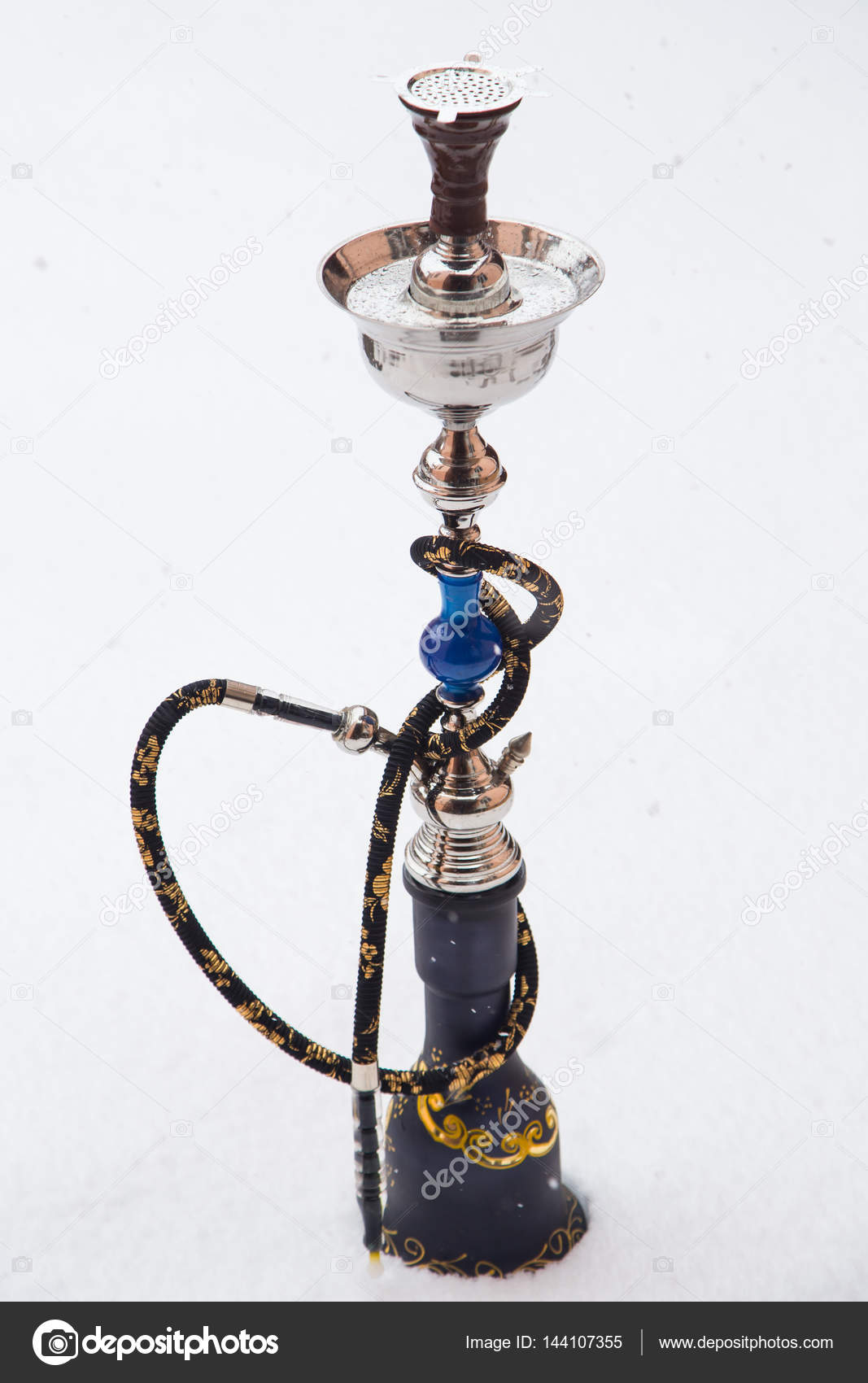 Big hookah for tobacco made of metal, glass and ceramics. Snowing