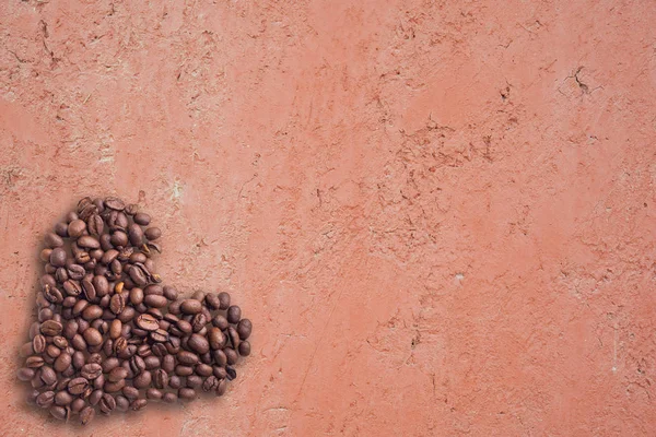 Coffee beans in form of heart on beautifull background. Love. Insparation. On concrete background. — Stock Photo, Image