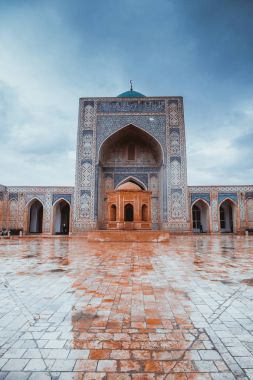Inside the complex of buildings of Poi Kalyan, Bukhara, Uzbekistan. inner courtyard of the Kalyan Mosque clipart