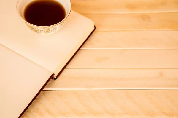 Mix of office supplies and gadgets on a wooden table background. — Stock Photo, Image