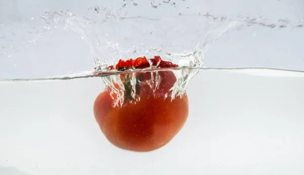 Splashing Tomatoes in water