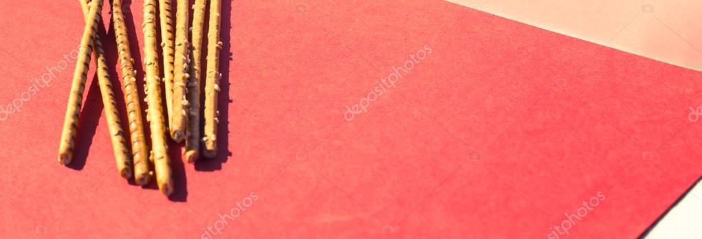 Salty sticks on red Royalty Free Stock Photos
