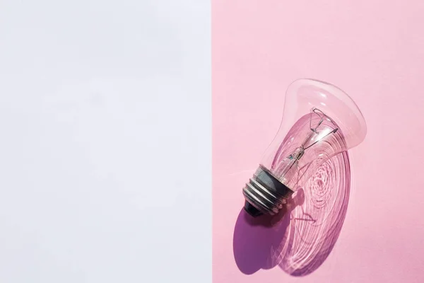 New Idea Conception. A bulb on divided background from above. — Free Stock Photo