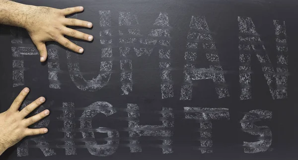 Conceito de direitos humanos: O texto: Dia dos direitos humanos escrito em quadro negro . — Fotografia de Stock