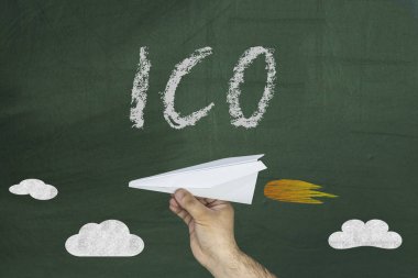 ICO - The initial concept of coin placement for the funding startup projects. Paper airplane and ICO text on chalkboard clipart