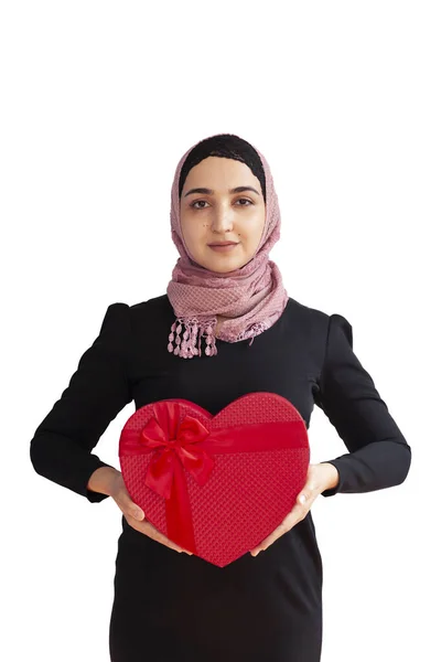 Muslim girl receiving a big present. Iranian woman holding a gift box. Middle-eastern female getting prepare presents and gifts. Shopping concept