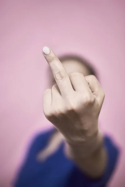 Rude feminist showing middle finger. Fuck you or fuck covid-19 symbol