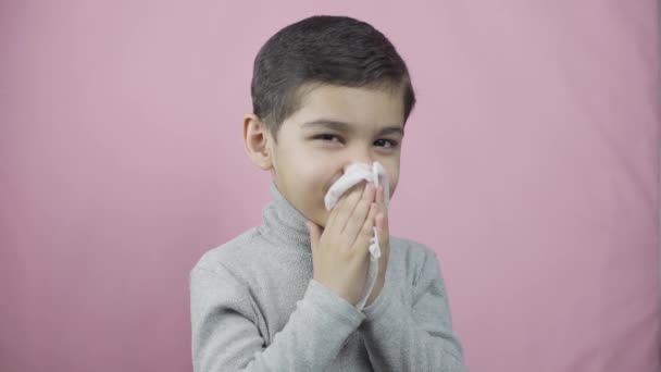 Little boy blowing nose. Sick coughing child sneezing — Stock Video