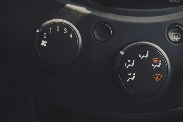 Car air conditioning system. Close-up view of car air conditioner switch buttons. Control panel of car air conditioner dashboard