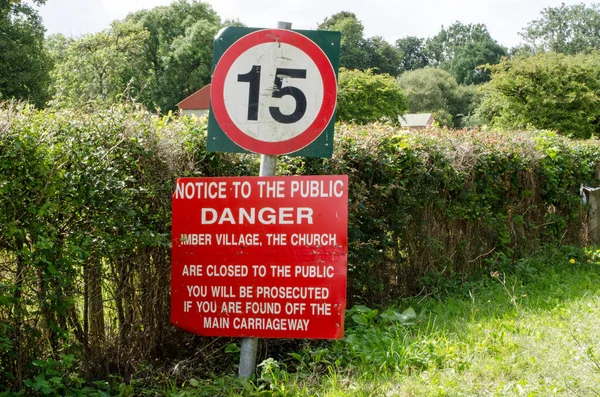 Warning sign in Imber village, Wiltshire. The area is in the middle of the Salisbury Plain military training area and public access is restricted. — Stock Image Warning Sign Imber Village Wiltshire Area Middle Salisbury Plain Military Royalty Free Stock Photos