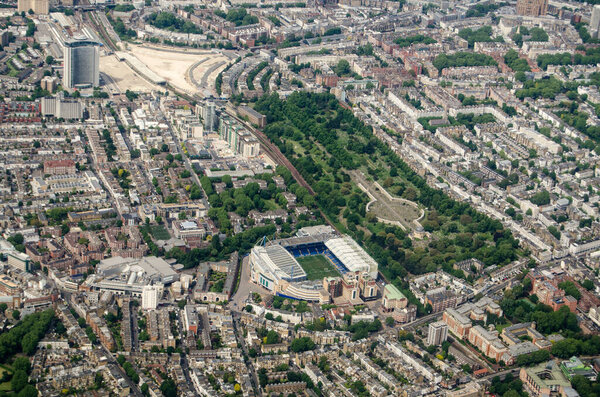 Aerial view looking north across Chelsea and Earls Court with the Stamford Bridge Stadium - home to Chelsea Football Club and Brompton Cemetary in the middle.  Top left is the Empress State Bilding and site of the former Earls Court exhibition halls.