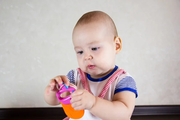 Little baby playing with toy — Stock Photo, Image