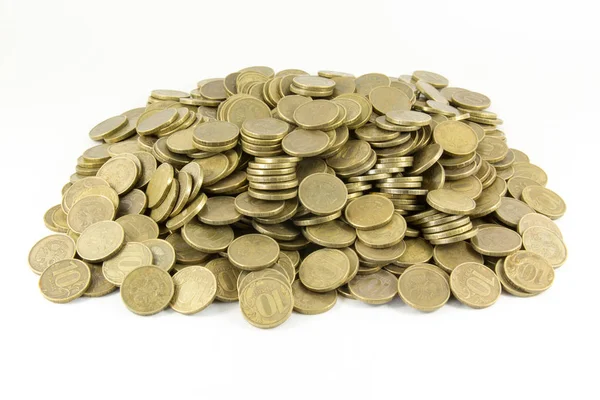 A lot of coins on a white background — Stock Photo, Image