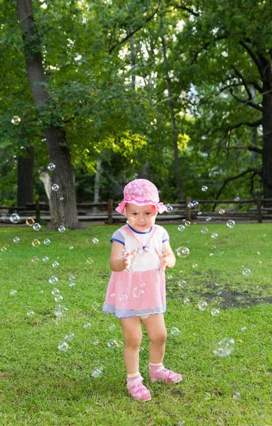 Portrait of a baby and soap bubbles — Stock Photo, Image