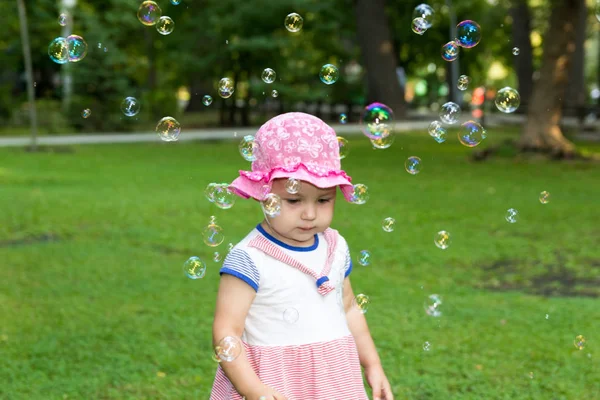 Portrait of a baby and soap bubbles — Stock Photo, Image