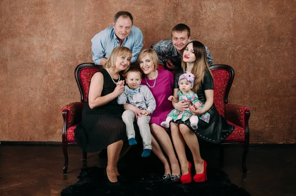 Three Generation Family Sitting On Sofa Together. Classic portrait — Stock Photo, Image