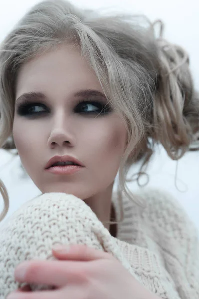 Close up of beautiful young  blonde woman with blue eyes in white pullover. — Stock Photo, Image