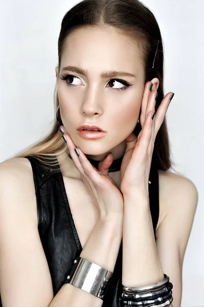 Punk rock style. Fashion woman model face with glamour makeup. P