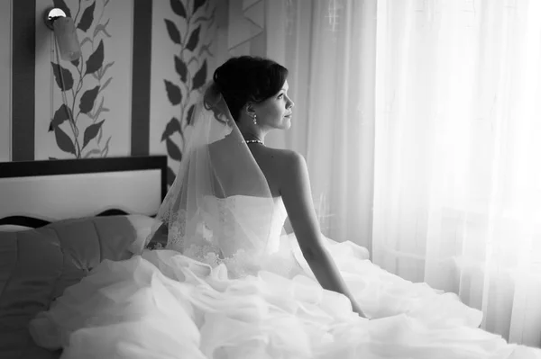 Portrait of beautiful bride with fashion veil posing at home at — Stock Photo, Image