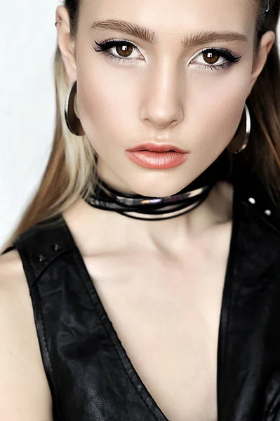 Punk rock style. Fashion woman model face with glamour makeup. P