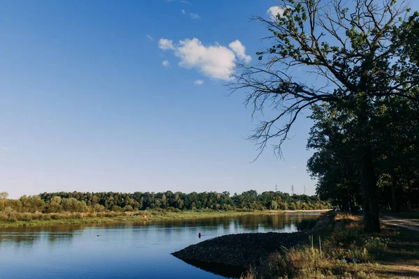 The river with a quiet current and clouds reflected in it, Soz, Gomel, Belarus — стоковое фото